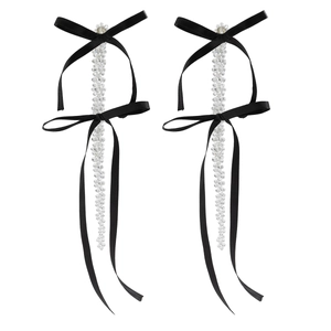 Detail of black satin ribbon bows with faceted crystal beads and elegant long tassels