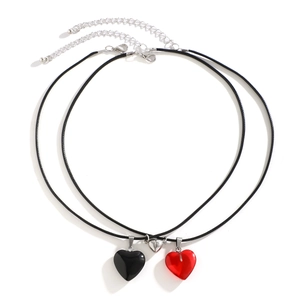 Vintage magnetic heart necklace set with red and black resin pendants on black cord