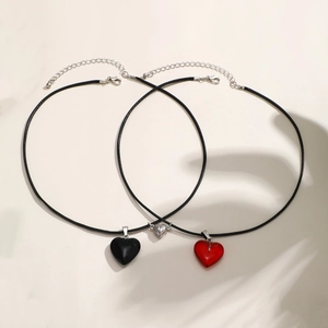 Magnetic heart couple necklaces set with black and red pendants on wax cord