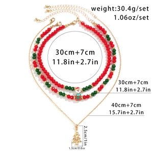 Three-piece Christmas choker set with snowman and gift charms on red and green beads