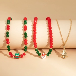 Detail of Christmas beaded bracelets and tree necklace with Santa and gift charms
