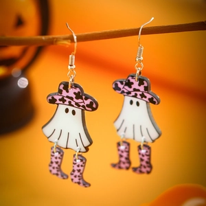 Ghost earrings with pink cow print hat and boots hanging on a festive wooden branch