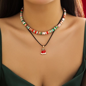 Detail of Christmas polymer clay choker set featuring red bell pendant and festive beads
