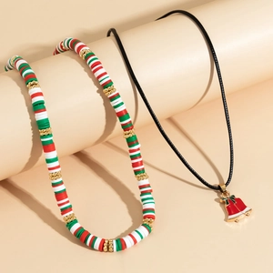 Detailed shot of Christmas polymer clay heishi beads necklace with enamel bell pendant