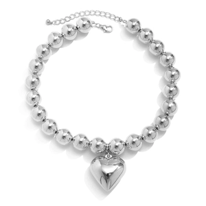 Close-up of silver metal bead necklace with large heart pendant and adjustable clasp