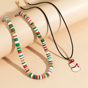 Detailed view of Christmas clay bead necklace set with a snowman pendant and black cord