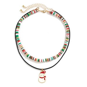 Close-up of double-layer Christmas necklace with clay beads and snowman pendant charm