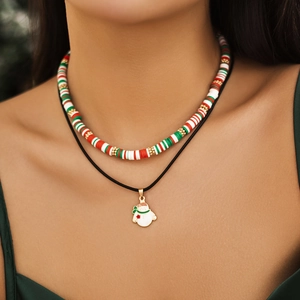 Close-up of double-layer Christmas necklace set with colorful beads and a snowman charm