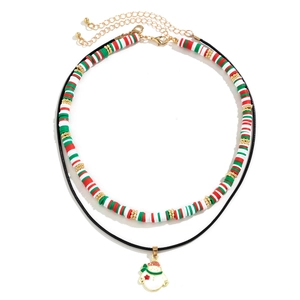 Detailed view of Christmas snowman pendant necklace with festive red and green clay beads