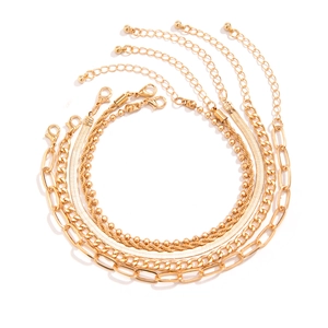 Detailed set of five gold layered anklets with paperclip, snake, and curb chain designs
