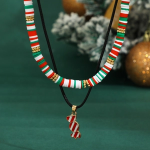 Detail of Christmas beaded choker and wax cord necklace with striped candy cane pendant