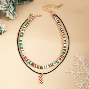 Detail of Christmas beaded choker with Heishi beads and candy cane pendant charm