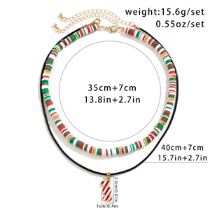 Christmas necklace set with snowman beads and candy cane pendant on white background