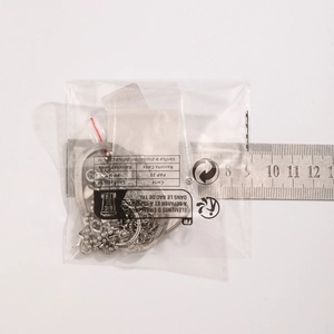 Silver punk anklet set with snake chain and beads shown with a scale for size reference