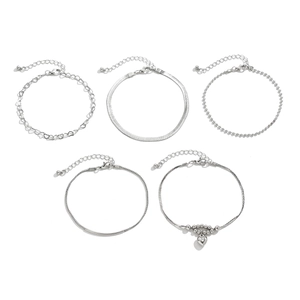 Detail view of a 5-piece silver anklet set featuring heart charms and snake chain textures