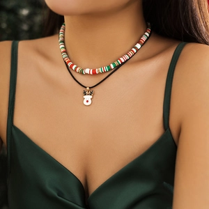 Close-up of double-layer Christmas necklace with festive Heishi beads and reindeer charm
