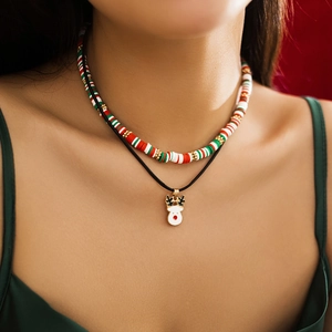 Detail of Christmas snowman reindeer necklace set with festive clay beads and elk pendant