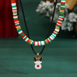 Detail of Christmas snowman and elk pendant necklace set with colorful clay beads