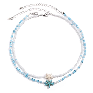 Close-up of double-layer beaded necklace with starfish pendants and seaside shell style