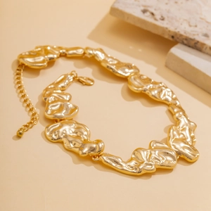 Detail of gold liquid metal choker with irregular lava texture and lobster clasp closure