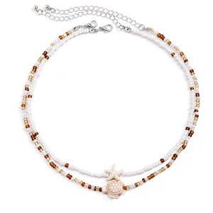 Detail of beaded sea star and turtle necklace set with silver adjustable clasp and chain