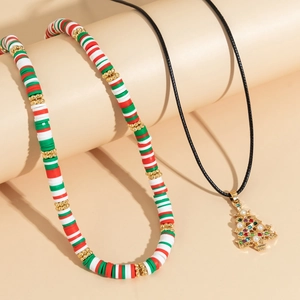 Detailed Christmas tree pendant with colored rhinestones and clay choker on display