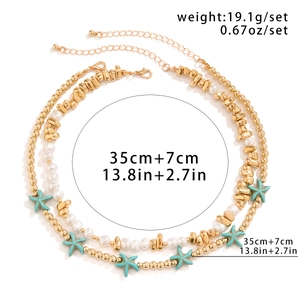Detail of beach necklace set with starfish pendant and turquoise beads showing size specs
