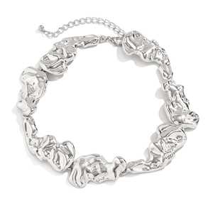 Detailed macro view of silver liquid metal choker with irregular lava texture links