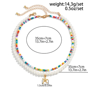 Detail view of beach starfish pendant necklace with size labels and lobster clasp closure