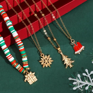 Detailed shot of Christmas jewelry set with clay beads, snowflake and bell pendants