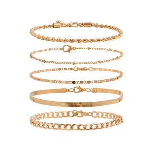 Detailed set of five gold punk anklets featuring snake chains and beaded heart charms