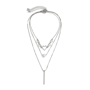 Minimalist silver layered necklace set featuring heart charms and sleek snake chain pendants