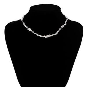 Macro shot of silver lava liquid metal choker with irregular crinkle texture detail