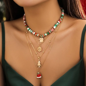 Christmas layered necklace set with beaded snowman charms and gold snowflake pendants