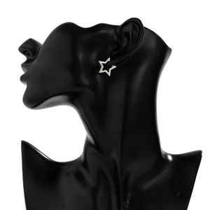 Detail of minimalist silver star earrings displayed on a black jewelry bust stand