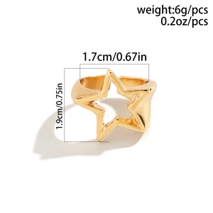 Detailed view of adjustable star-shaped gold ring with hollow geometric metal design