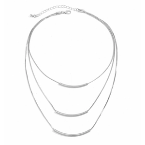 Close-up of triple-layered silver snake chain necklace with curved metal tube pendants