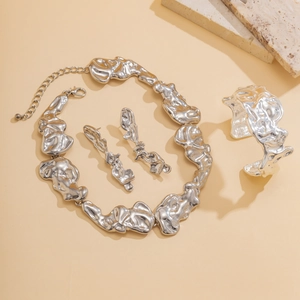 Irregular lava liquid metal style jewelry set with necklace earrings and wide cuff bracelet