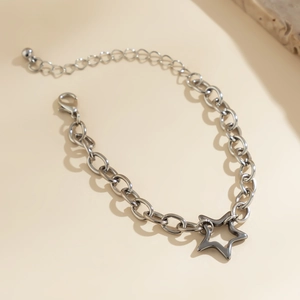 Detailed shot of silver star necklace with classic chain and adjustable lobster clasp closure