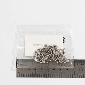 Silver star necklace chain length measurement with ruler and lobster clasp detail