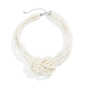 Detail of multi-layer faux pearl necklace with silver lobster clasp and extender