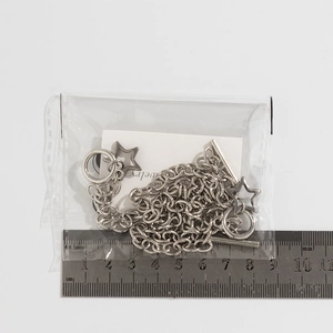 Detail of silver star pendant necklace with OT toggle clasp shown with measuring ruler