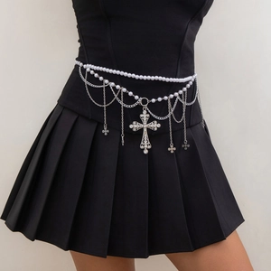Detail of multi-layer pearl waist chain with silver cross pendants and rhinestones