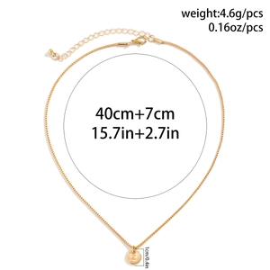 Detail view of gold letter Z round pendant necklace with size 40+7cm and 4.6g weight