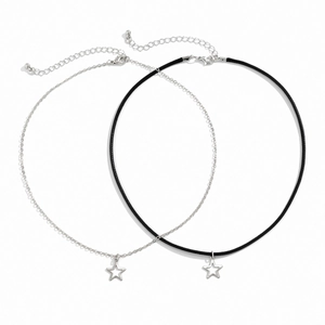 Detail of silver star pendants on thin metal chain and black cord with lobster clasp