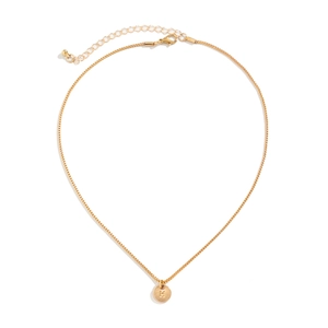 Detail of gold letter H coin pendant with box chain and lobster clasp closure