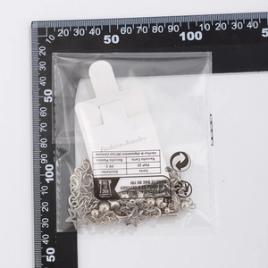 Silver star necklace package with branded card and measuring ruler for size guide