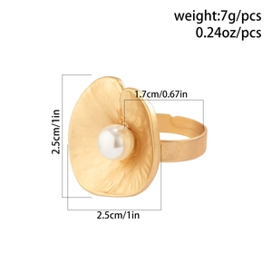 Detailed size view of a gold flower ring with pearl and matte textured metal petals