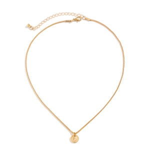 Detailed view of golden necklace featuring a round disc pendant engraved with letter P