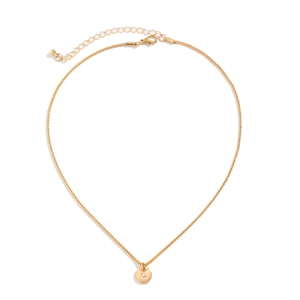 Detail of gold box chain necklace with engraved letter Q round pendant and lobster clasp